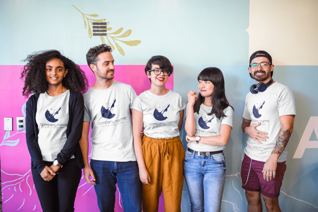 interracial group of five coworkers wearing t shirts mockup at a startup a20413 - Automate Your Corporate Swag Bag In 3 Easy Steps - For HRs & Companies in India - 2025 Corporate Employees Wearing Official Swag | Corporate Swag Bag